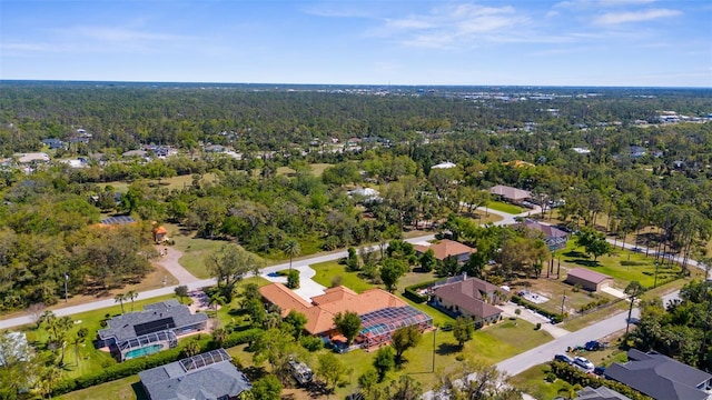 drone / aerial view with a residential view and a forest view