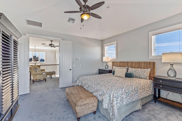 bedroom with vaulted ceiling, visible vents, a ceiling fan, and carpet floors