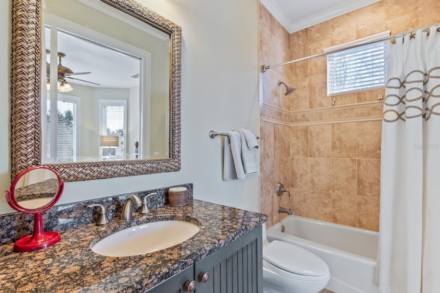 bathroom with shower / bathtub combination with curtain, toilet, ceiling fan, and vanity