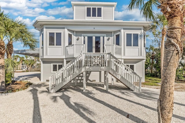 view of front of home with french doors and stairs