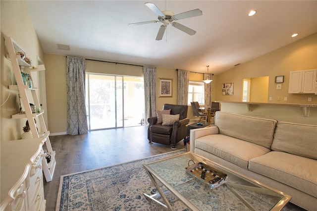 living area with visible vents, wood finished floors, recessed lighting, ceiling fan, and vaulted ceiling