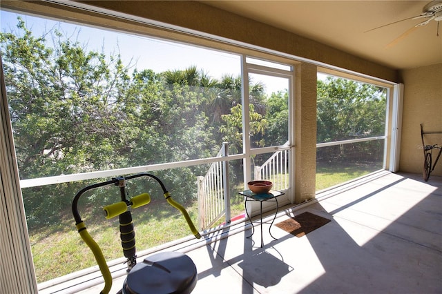 sunroom with a ceiling fan