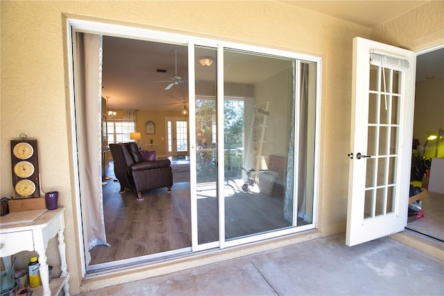 entrance to property featuring stucco siding