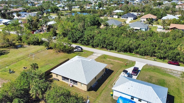 birds eye view of property with a residential view