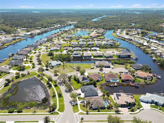 drone / aerial view featuring a residential view and a water view