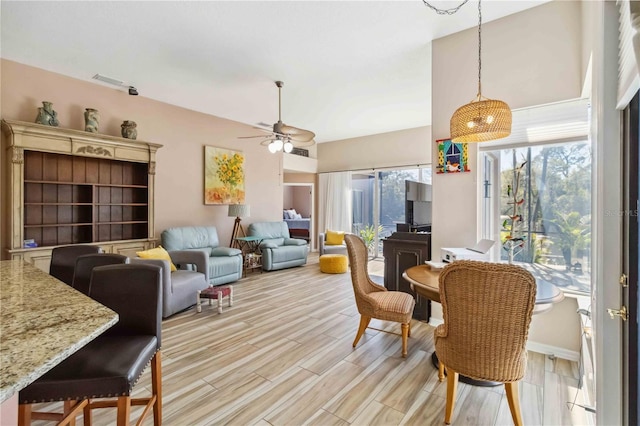 dining area featuring visible vents, light wood finished floors, and ceiling fan