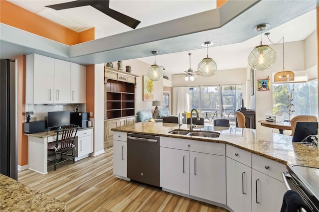 kitchen with a ceiling fan, light wood-style flooring, a sink, stainless steel appliances, and white cabinetry