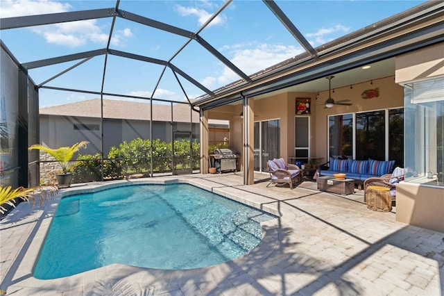 view of pool featuring area for grilling, a patio, glass enclosure, outdoor lounge area, and ceiling fan