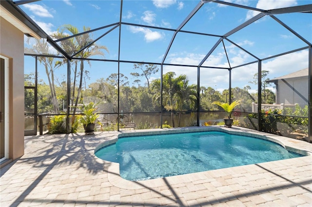 pool with a patio and a lanai