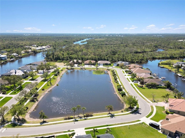 bird's eye view featuring a residential view and a water view