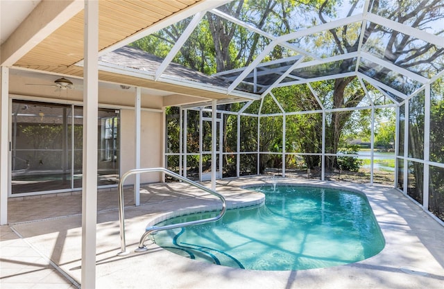 outdoor pool featuring a patio and a lanai