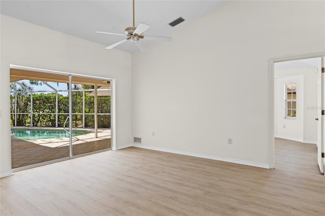 unfurnished room with visible vents, light wood-type flooring, and baseboards