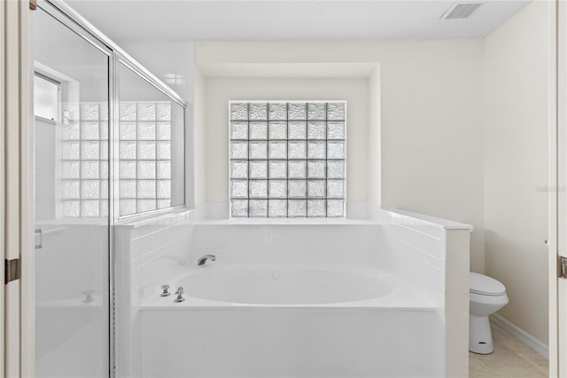 bathroom with visible vents, a garden tub, a stall shower, and toilet