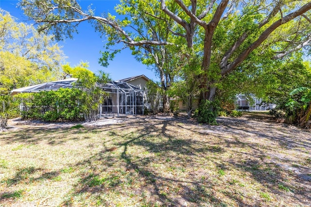 view of yard featuring a lanai