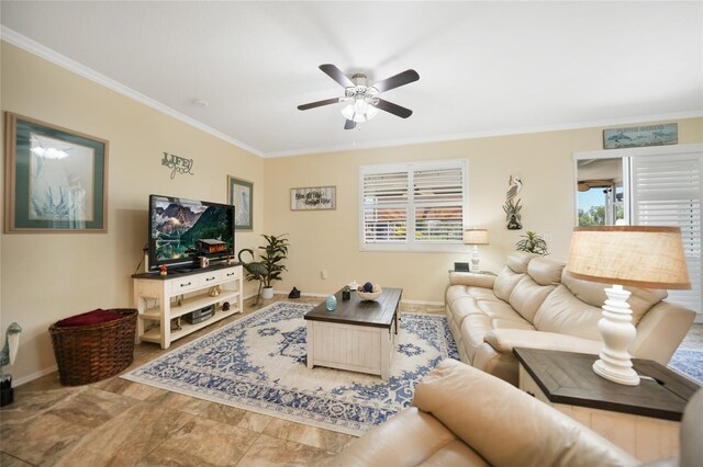 living area featuring a healthy amount of sunlight, baseboards, a ceiling fan, and ornamental molding