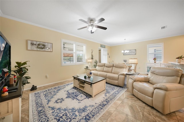 living area with crown molding, ceiling fan with notable chandelier, visible vents, and baseboards