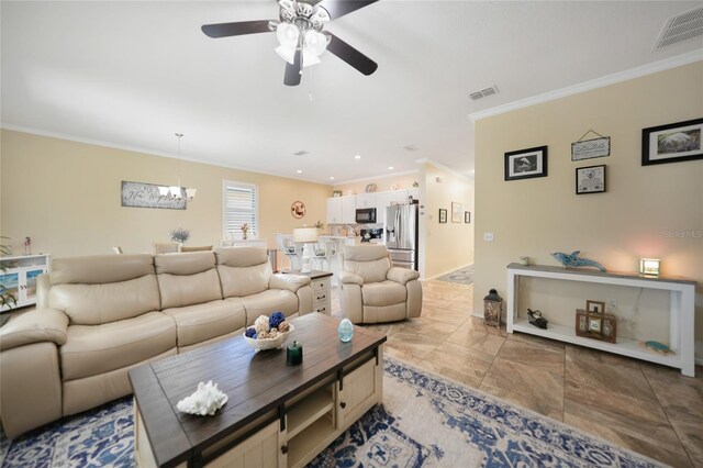 living room with recessed lighting, ceiling fan with notable chandelier, visible vents, and ornamental molding