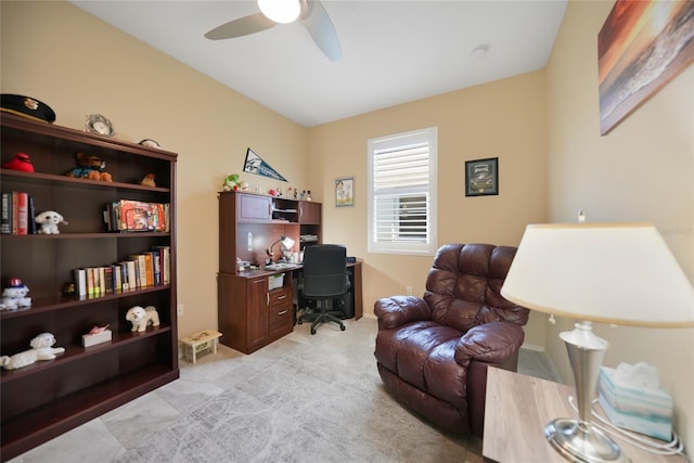 office area featuring baseboards and a ceiling fan