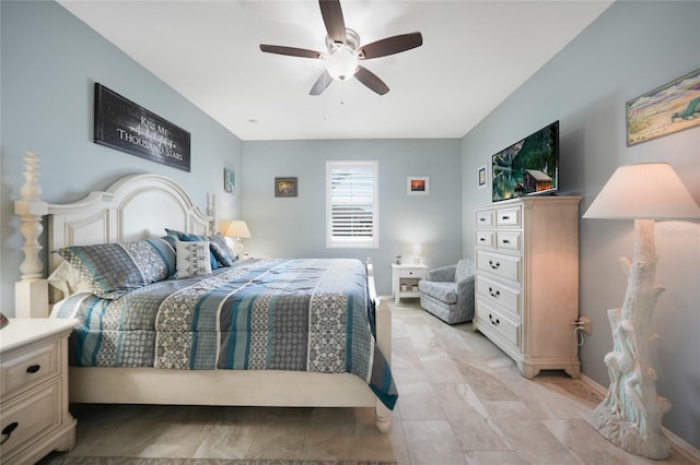 bedroom with baseboards and a ceiling fan