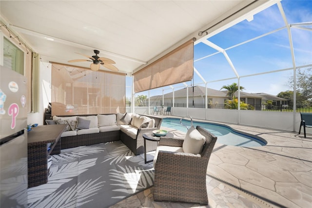 view of patio with fence, a lanai, outdoor lounge area, a fenced in pool, and ceiling fan