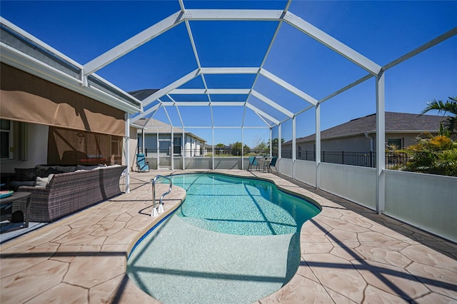 view of swimming pool with an outdoor living space, a fenced in pool, a patio, and a lanai