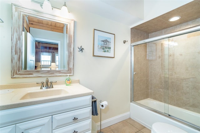 full bath with toilet, baseboards, tile patterned flooring, enclosed tub / shower combo, and vanity