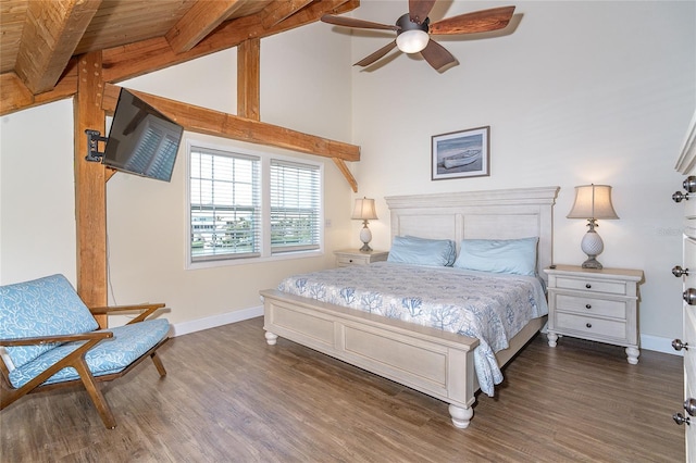 bedroom with baseboards, dark wood-type flooring, and high vaulted ceiling