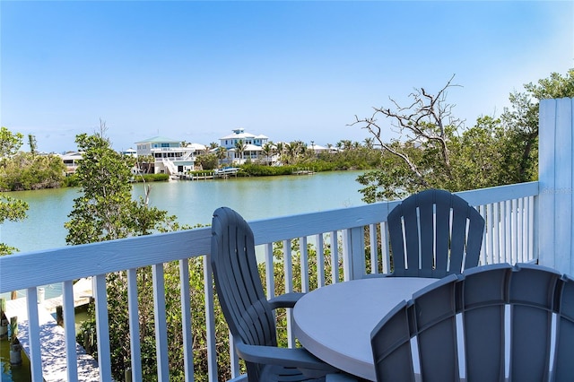 balcony featuring a water view