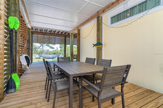 wooden terrace featuring outdoor dining space