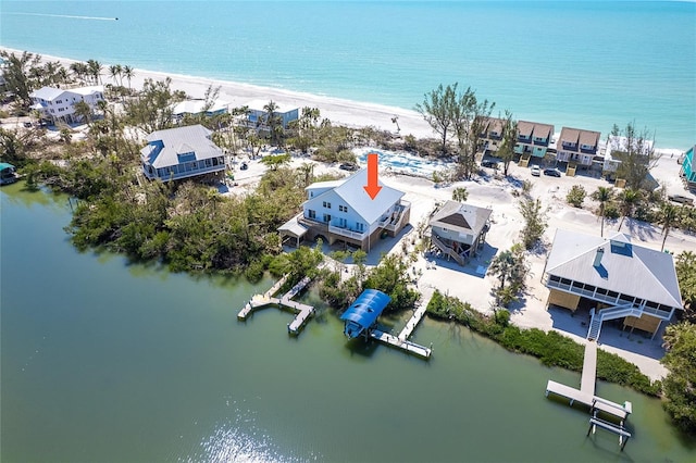 drone / aerial view with a view of the beach and a water view