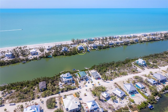 bird's eye view with a view of the beach and a water view