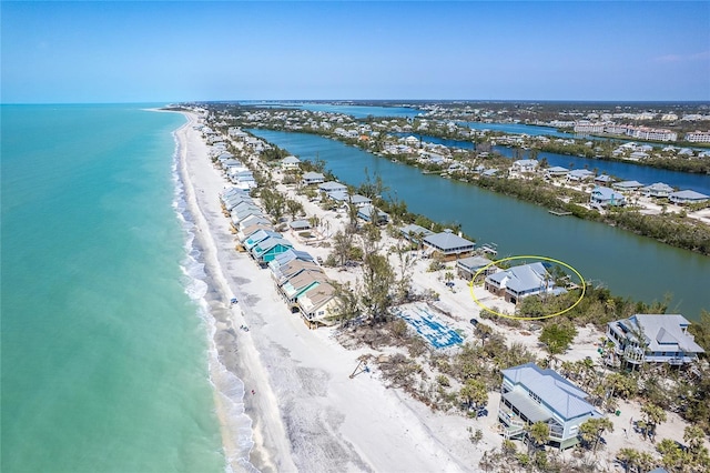 bird's eye view with a beach view and a water view