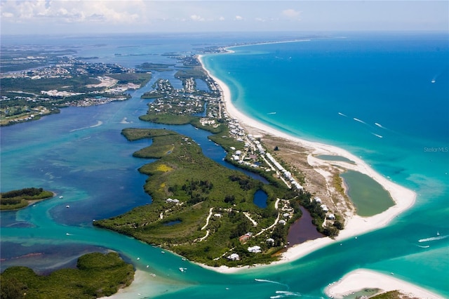 bird's eye view featuring a water view and a view of the beach