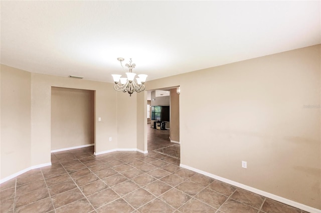 unfurnished room with light tile patterned floors, visible vents, baseboards, and an inviting chandelier