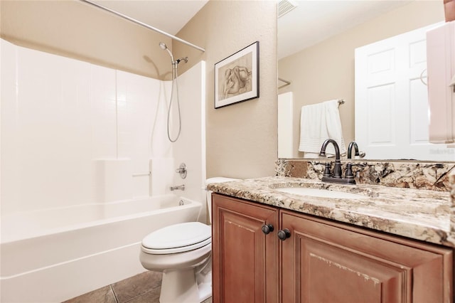 full bath with vanity, washtub / shower combination, visible vents, tile patterned flooring, and toilet