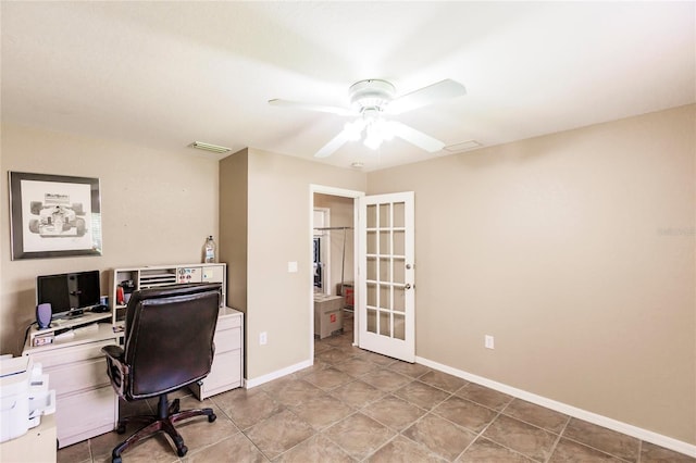 home office featuring light tile patterned floors, visible vents, baseboards, ceiling fan, and french doors