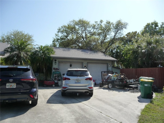 exterior space with driveway and fence