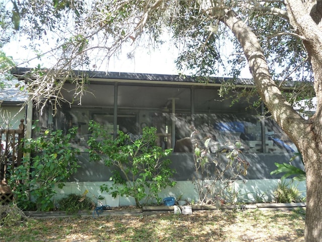 exterior space featuring a sunroom