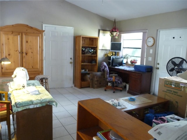 office featuring light tile patterned flooring and vaulted ceiling