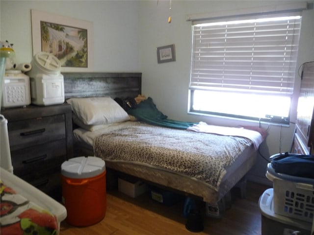 bedroom featuring wood finished floors