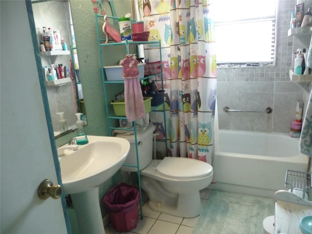 full bathroom featuring tile patterned floors, toilet, and shower / tub combo with curtain