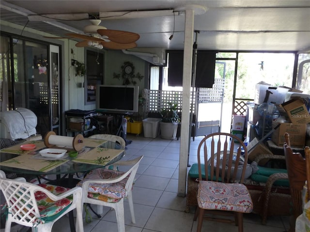 tiled dining space featuring a ceiling fan