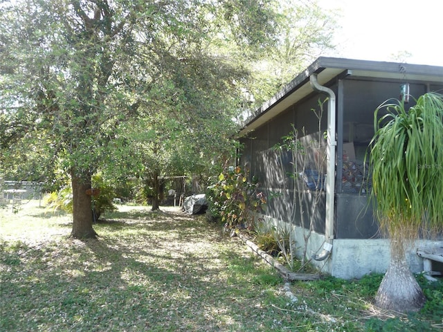 view of yard featuring a sunroom