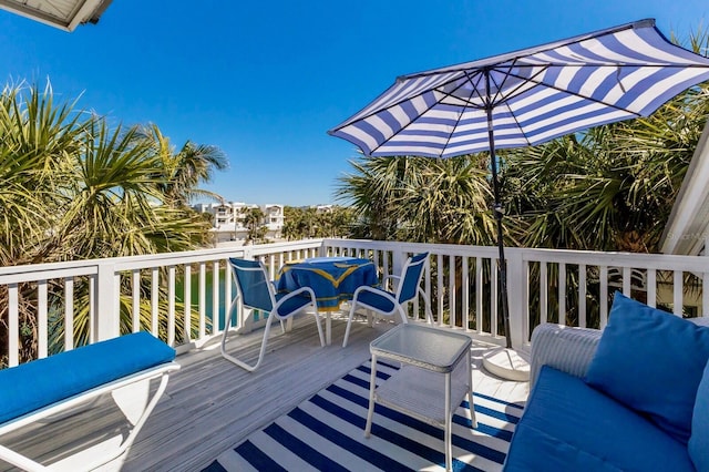 wooden deck featuring outdoor lounge area