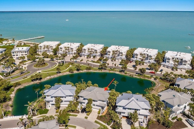 bird's eye view with a residential view and a water view