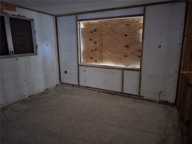 empty room with unfinished concrete floors