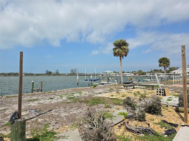 view of dock featuring a water view and boat lift