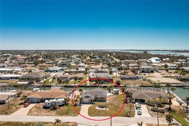 aerial view with a residential view and a water view