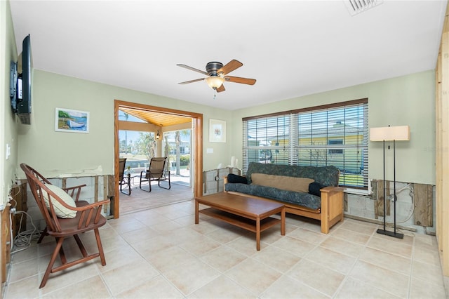 tiled living area featuring visible vents and ceiling fan