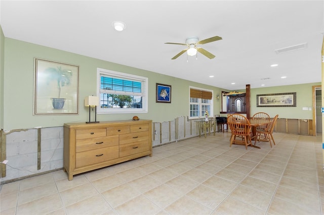 dining area with light tile patterned floors, a ceiling fan, recessed lighting, and a healthy amount of sunlight